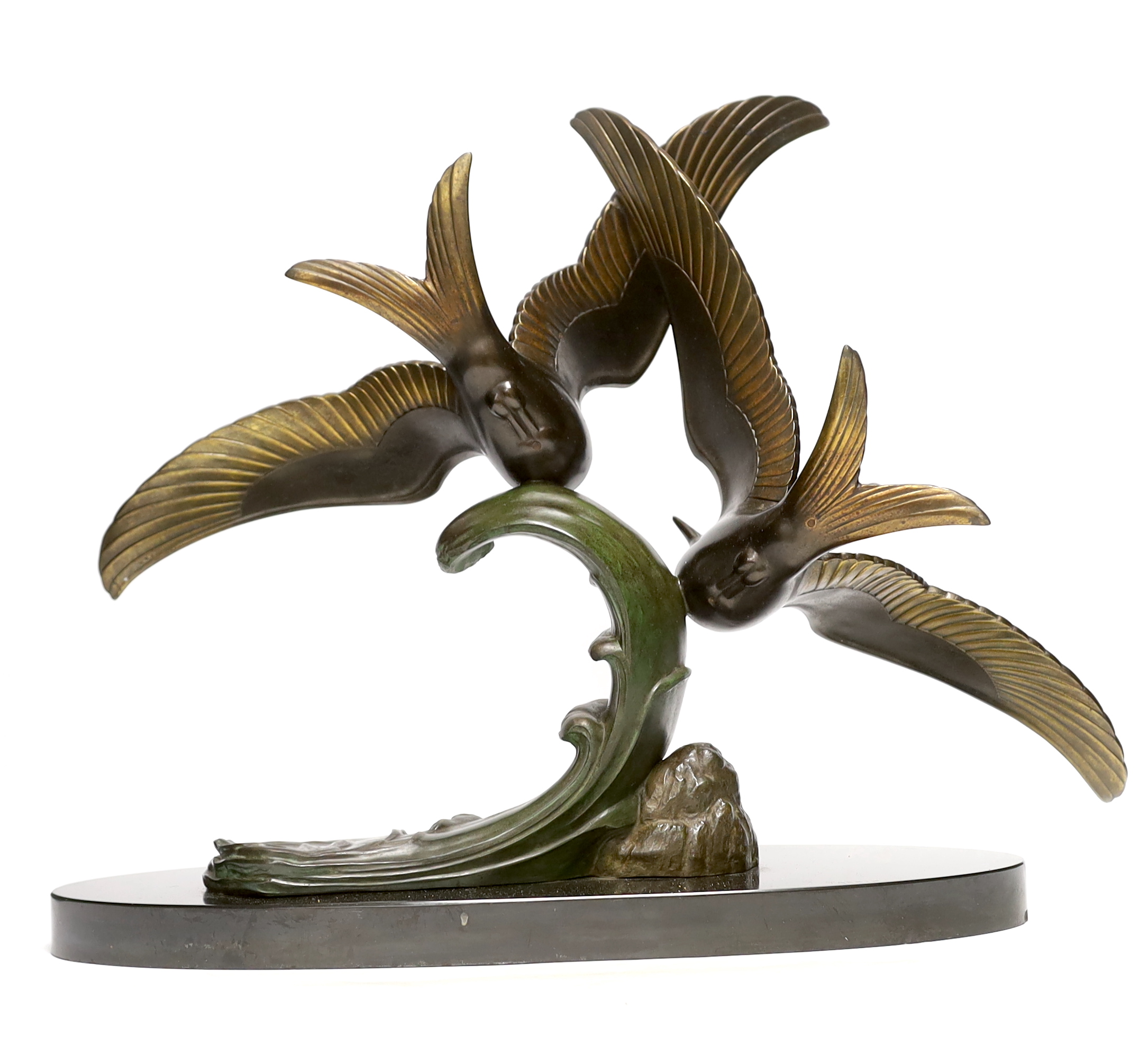 An Art Deco patinated spelter seagull group, signed Trebig, raised on slate base, 48cm wide